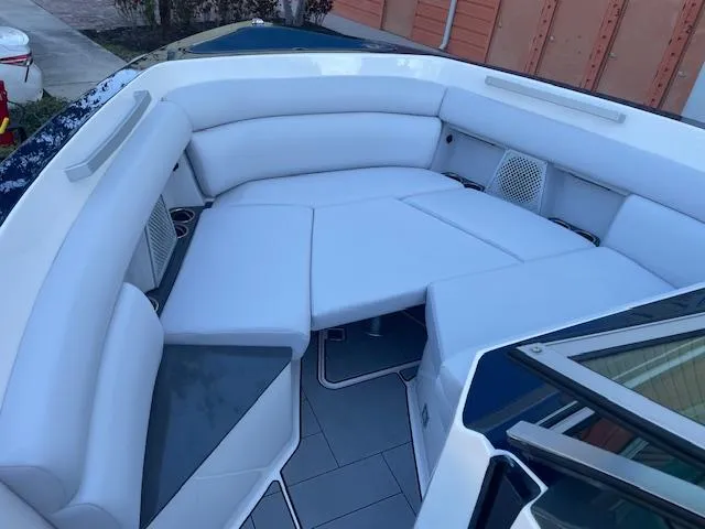 Slide: The Image of 2022 Aviara AV 32-OB boat interior with white cushioned seating. - 26