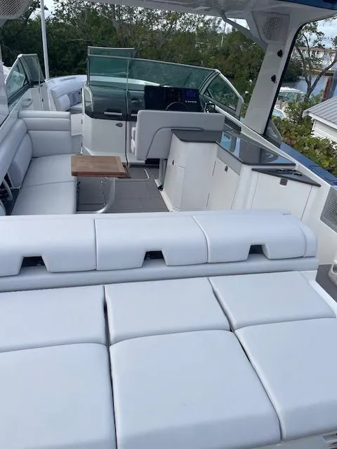 Slide: The Image of 2022 Aviara AV 32-OB boat interior with white seating and modern design. - 33