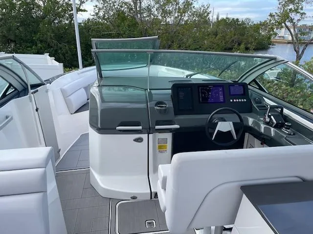 Slide: The Image of 2022 Aviara AV 32-OB boat interior with modern helm and seating. - 7