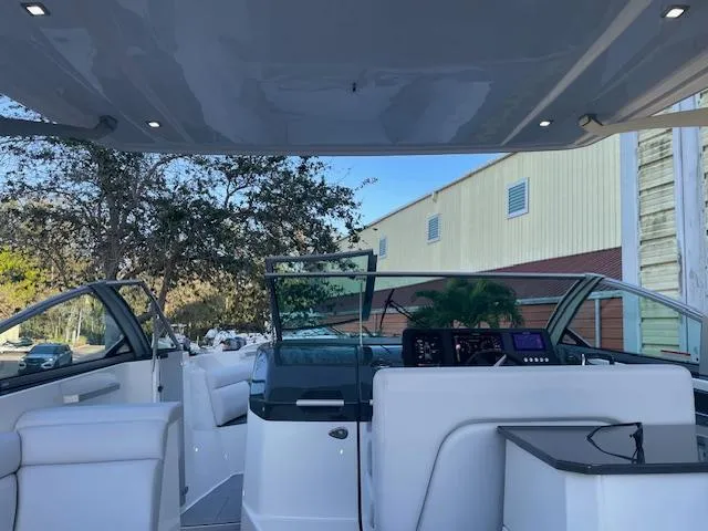 Slide: The Image of 2022 Aviara AV 32-OB boat interior with modern dashboard and seating. - 8