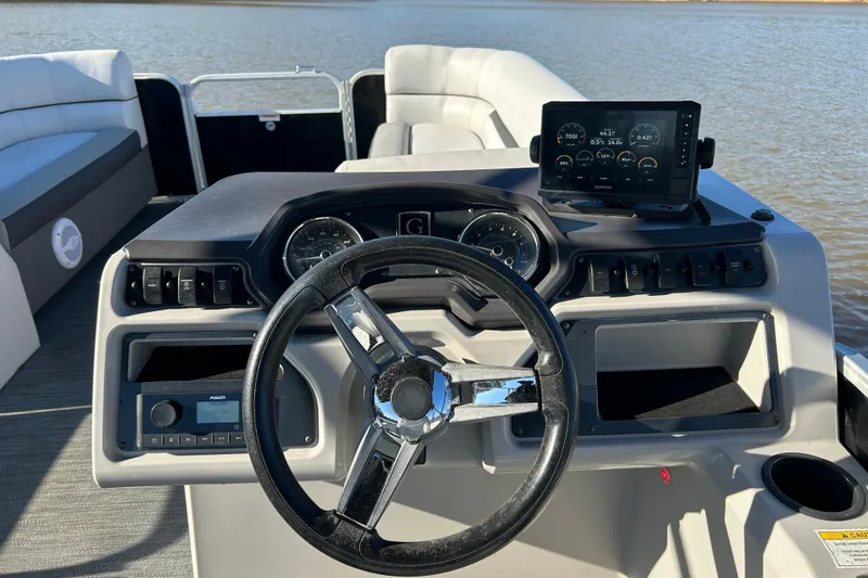 Slide: The Image of Steering console of 2022 Godfrey Sweetwater 2286 C pontoon boat with modern controls. - 12