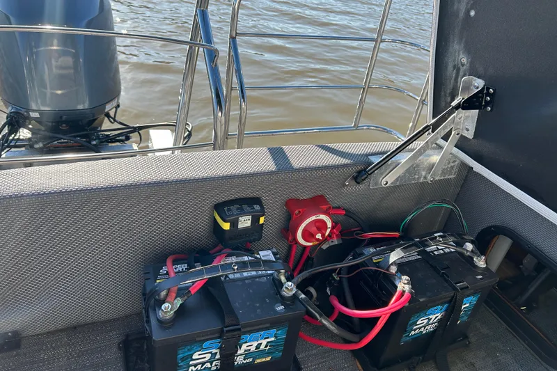 Slide: The Image of 2022 Godfrey Sweetwater 2286 C boat with battery setup and motor on water. - 20