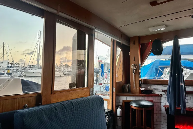 Slide: The Image of Interior view of 1987 Egg Harbor 43 Sport Fisherman yacht at marina during sunset. - 15