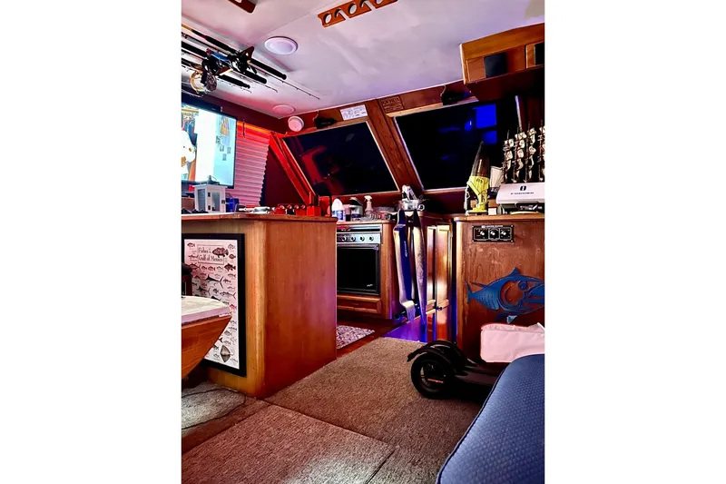 Slide: The Image of Interior of 1987 Egg Harbor 43 Sport Fisherman boat with fishing gear and cozy cabin. - 17