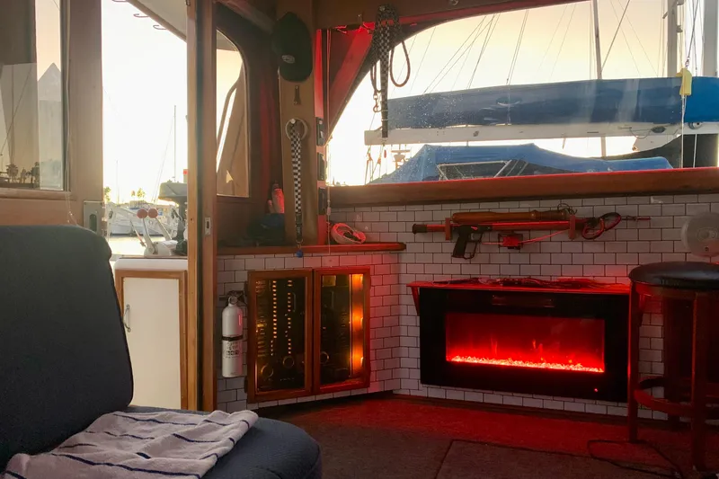 Slide: The Image of Cozy interior of 1987 Egg Harbor 43 Sport Fisherman with electric fireplace and nautical decor. - 20