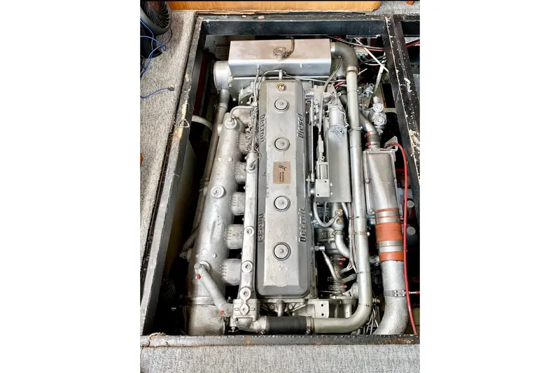 Slide: The Image of Engine of a 1987 Egg Harbor 43 Sport Fisherman boat, showcasing intricate mechanical details. - 25