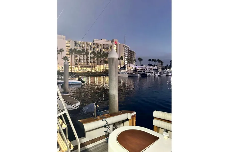 Slide: The Image of Marina view from 1987 Egg Harbor Sportfisher, with hotel and yachts in the background. - 26