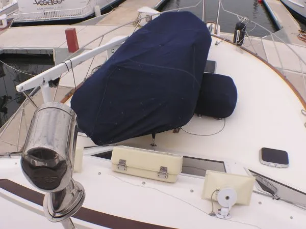 Slide: The Image of 1987 Egg Harbor Sportfisher interior with stainless steel appliances and patterned floor mat. - 13