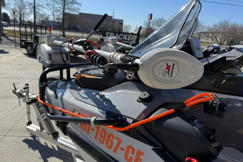 Slide: The Image of 2024 Sea-Doo FishPro Trophy 170 with fishing equipment and accessories, parked outdoors. - 10