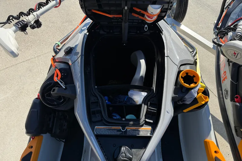 Slide: The Image of 2024 Sea-Doo FishPro Trophy 170 storage compartment with fishing gear and accessories. - 14
