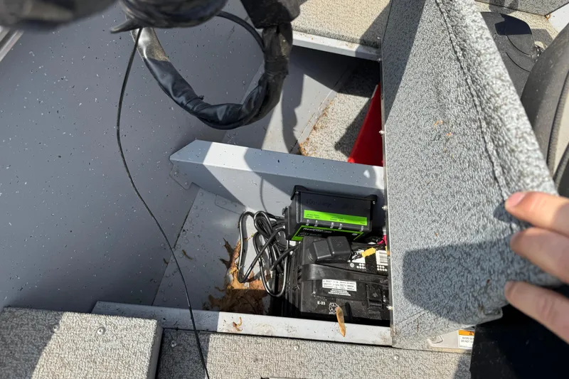 Slide: The Image of 2023 Lund 1600 Fury Tiller boat interior with battery compartment open. - 4