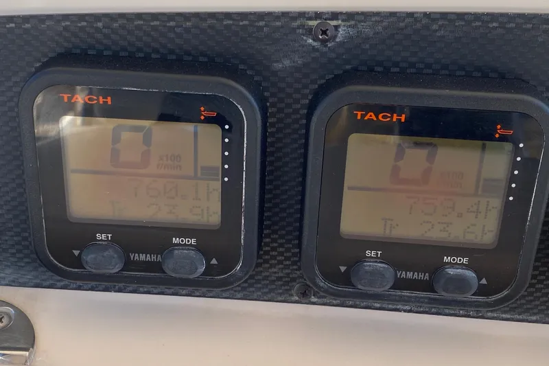 Slide: The Image of Yamaha tachometers on 2006 Grady-White Bimini 306 boat dashboard, displaying engine RPM. - 22