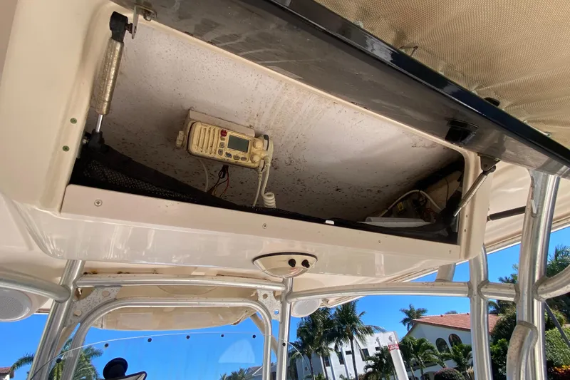 Slide: The Image of 2006 Grady-White Bimini 306 boat interior with helm, seats, and canopy. - 4