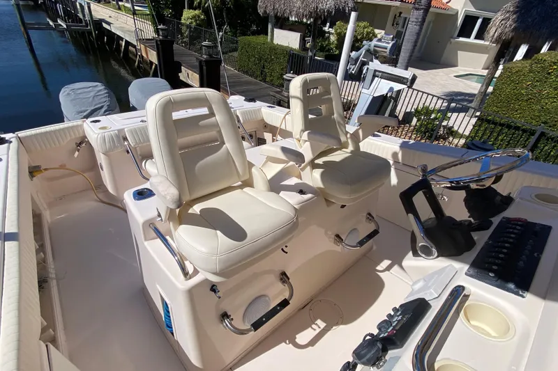 Slide: The Image of Control panel of a 2006 Grady-White Bimini 306 boat with radio and navigation equipment. - 5