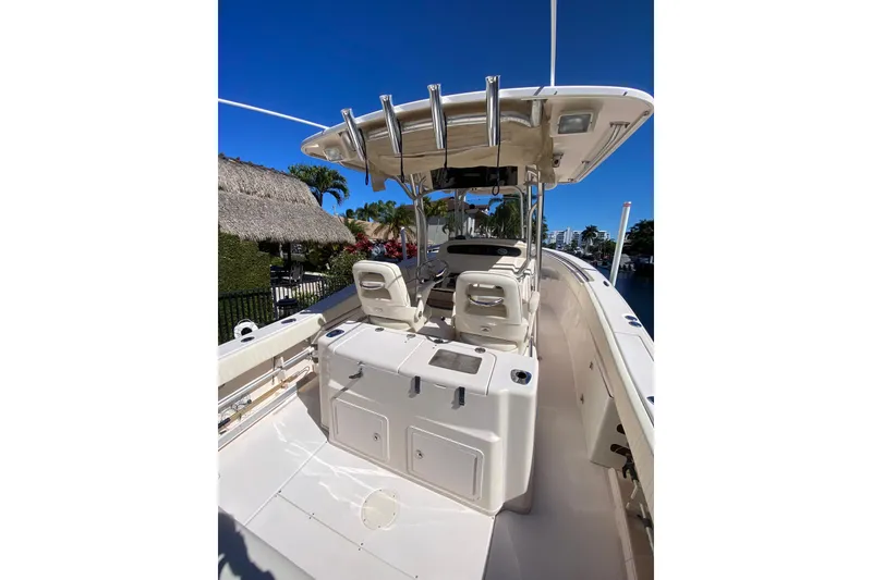 Slide: The Image of 2006 Grady-White Bimini 306 boat interior with dual captain's chairs and steering console. - 7