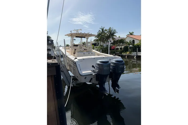 Slide: The Image of 2006 Grady-White Bimini 306 boat docked with dual Yamaha engines. - 29