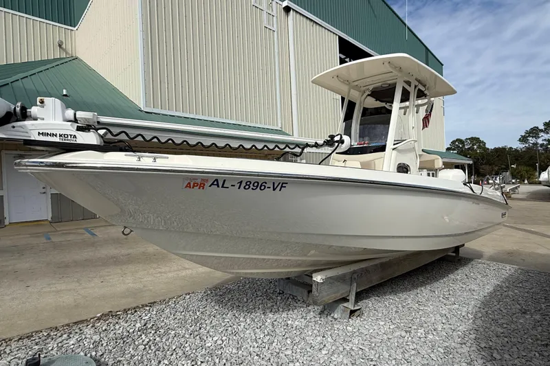 The Image of 2020 Boston Whaler 240 Dauntless boat with Minn Kota motor, docked outdoors. - 1
