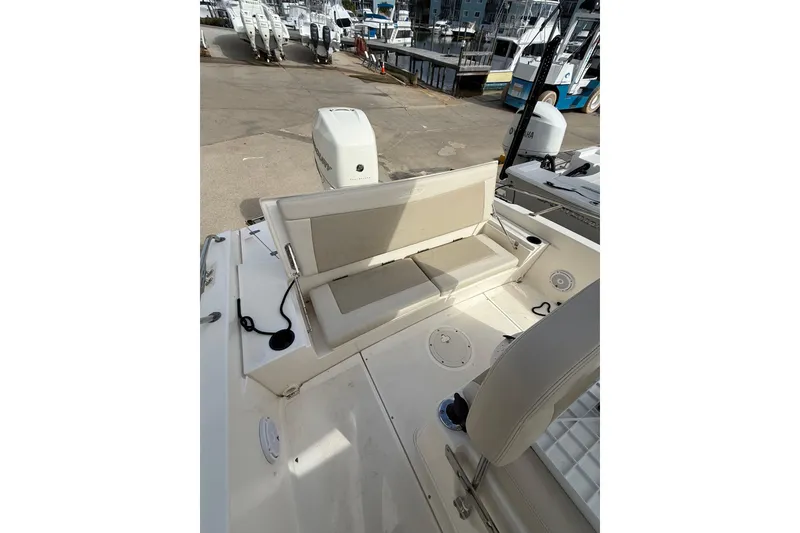 Slide: The Image of 2020 Boston Whaler 240 Dauntless boat interior with seating and motor view. - 10