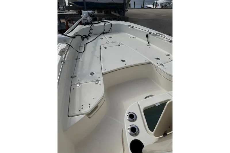 Slide: The Image of 2020 Boston Whaler 240 Dauntless boat deck with storage compartments and seating. - 8