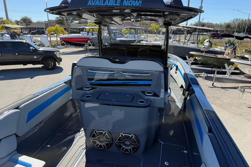 Slide: The Image of 2026 Sunsation 32 CCX boat interior with seating and speakers, available for purchase. - 13