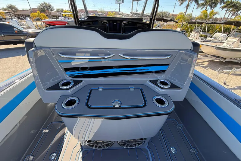 Slide: The Image of 2026 Sunsation 32 CCX boat interior with sleek design and cup holders. - 15