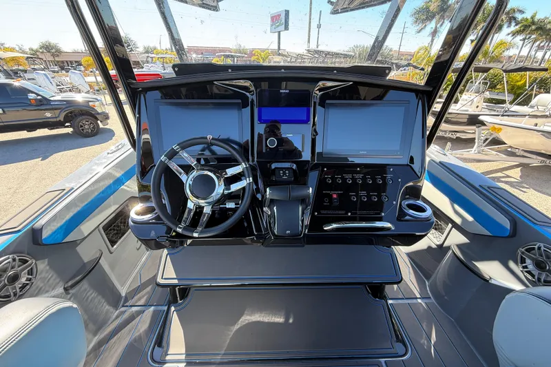 Slide: The Image of 2026 Sunsation 32 CCX boat dashboard with modern controls and dual screens. - 16
