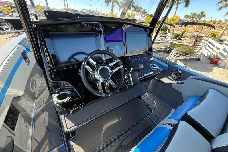 Slide: The Image of 2026 Sunsation 32 CCX boat cockpit with modern steering and dual displays. - 22