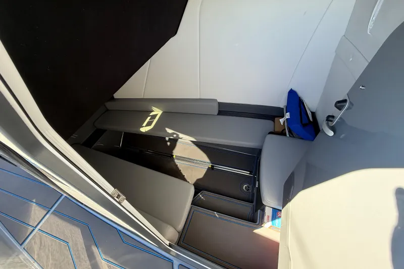 Slide: The Image of Interior view of 2026 Sunsation 32 CCX boat cabin with seating and storage. - 25