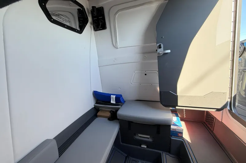 Slide: The Image of Interior cabin of 2026 Sunsation 32 CCX boat, featuring seating and storage. - 28