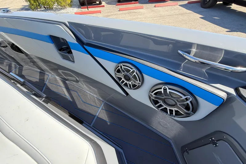 Slide: The Image of 2026 Sunsation 32 CCX boat interior with sleek design and modern audio speakers. - 36