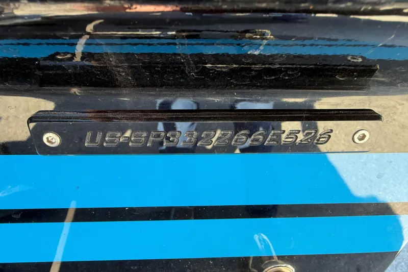 Slide: The Image of 2026 Sunsation 32 CCX boat hull identification number on blue-striped surface. - 39