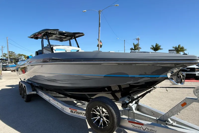 Slide: The Image of 2026 Sunsation 32 CCX boat on trailer, sleek design, sunny day background. - 5