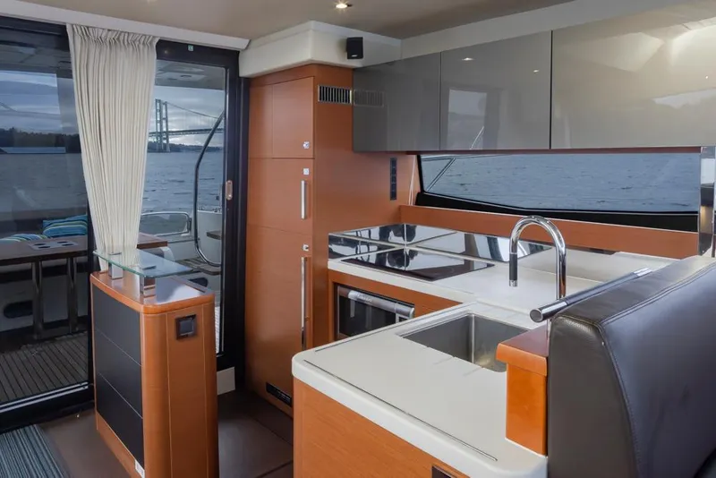 Slide: The Image of Interior of 2017 Prestige 560 yacht with modern kitchen and sleek design. - 14