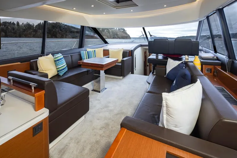 Slide: The Image of Luxurious interior of a 2017 Prestige 560 yacht with plush seating and scenic views. - 15