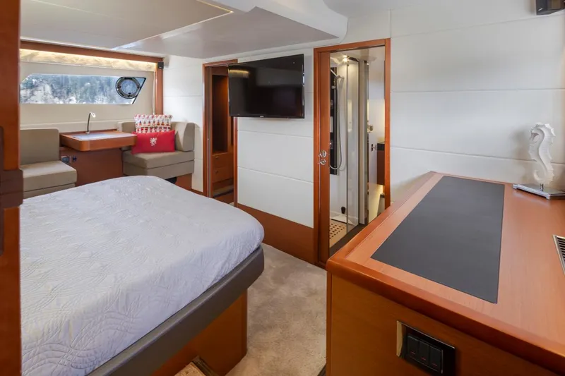 Slide: The Image of Luxurious interior of a 2017 Prestige 560 yacht with modern furnishings and a cozy bedroom. - 20