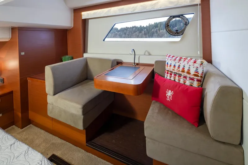Slide: The Image of Luxurious interior of 2017 Prestige 560 yacht with cozy seating and elegant decor. - 23