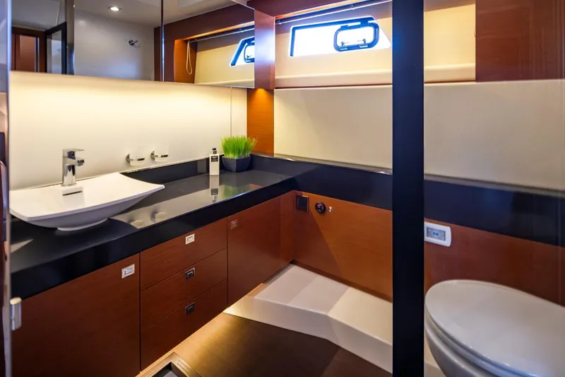 Slide: The Image of Luxurious bathroom interior of 2017 Prestige 560 yacht, featuring modern fixtures and elegant design. - 25