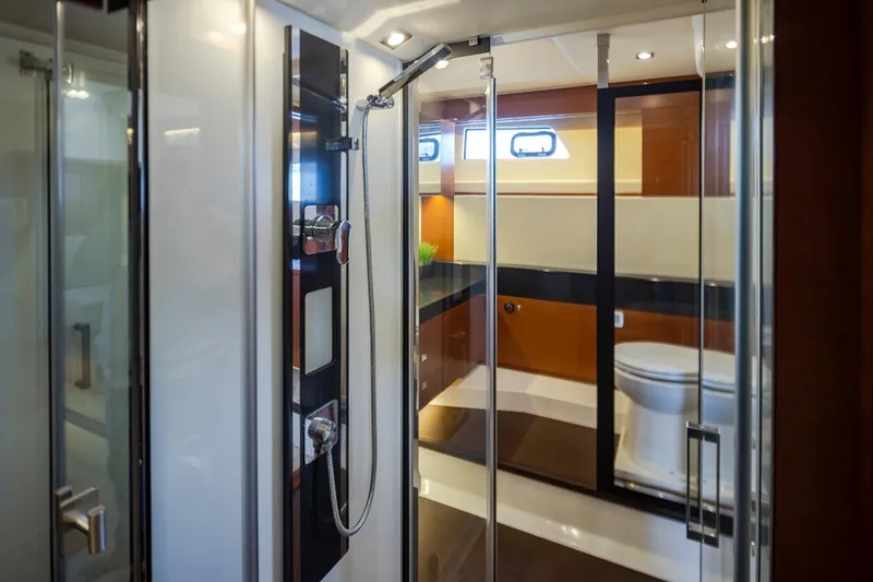Slide: The Image of Luxurious bathroom interior of 2017 Prestige 560 yacht with modern shower and toilet. - 28