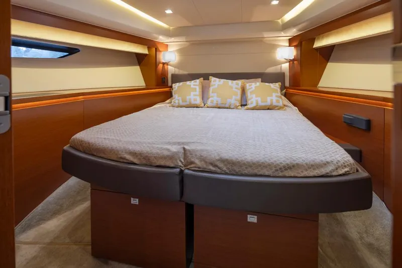 Slide: The Image of Luxurious bedroom interior of 2017 Prestige 560 yacht with modern design and cozy bedding. - 30