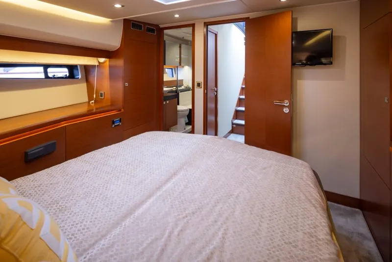Slide: The Image of Luxurious bedroom interior of 2017 Prestige 560 yacht with modern amenities and elegant design. - 31