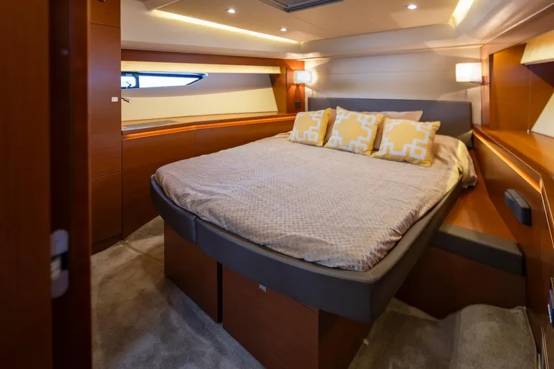 Slide: The Image of Luxurious bedroom interior of 2017 Prestige 560 yacht with modern design and cozy bedding. - 32