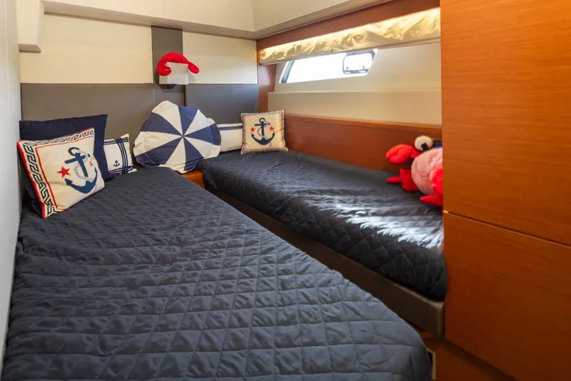 Slide: The Image of Twin cabin with nautical decor in 2017 Prestige 560 yacht. - 38