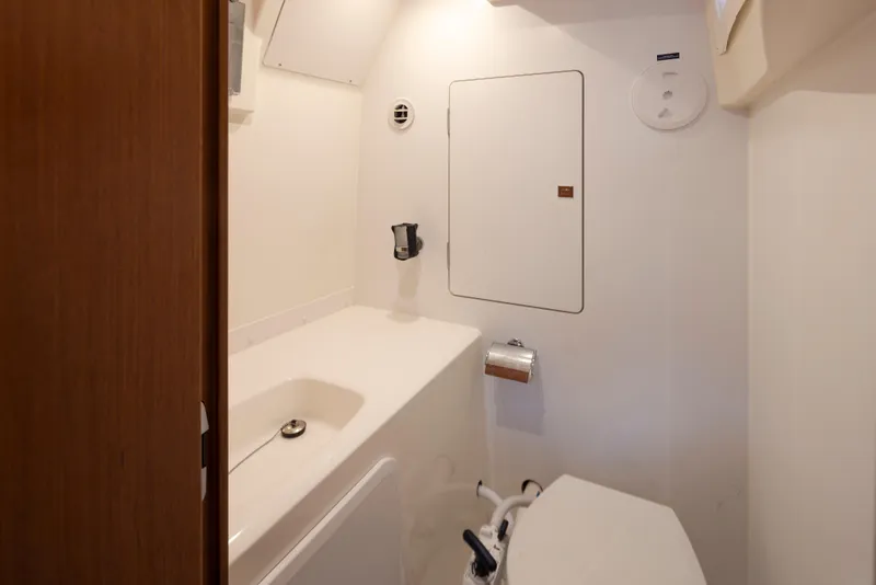 Slide: The Image of Compact bathroom in a 2017 Prestige 560 yacht, featuring modern fixtures and white interior. - 43