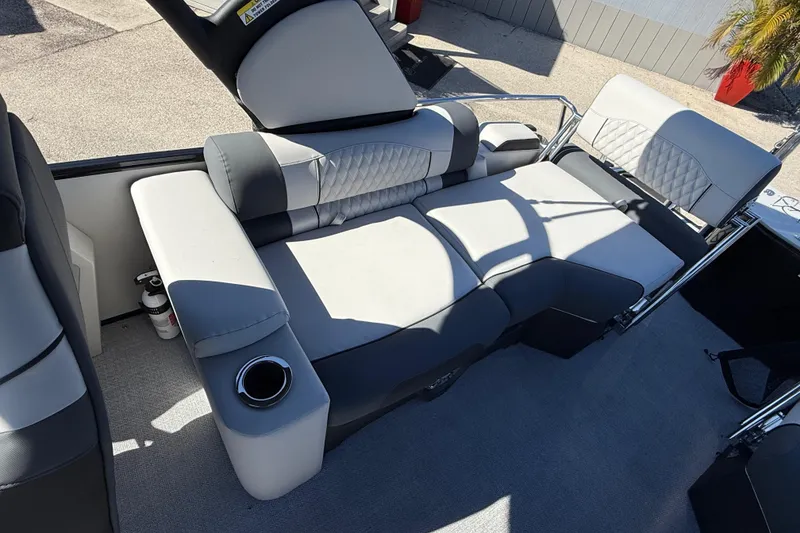 Slide: The Image of 2026 Avalon 2385 Catalina Quad Lounger with plush seating and cup holder on deck. - 19