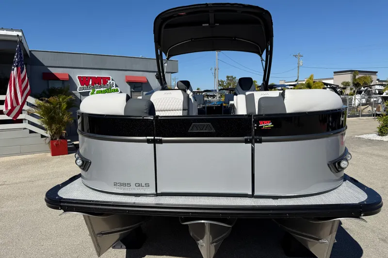 Slide: The Image of 2026 Avalon 2385 Catalina Quad Lounger Tri Toon boat at dealership, front view. - 4