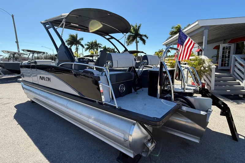 Slide: The Image of 2026 Avalon 2385 Catalina Quad Lounger, Tri Toon High Performance boat, parked outdoors. - 8