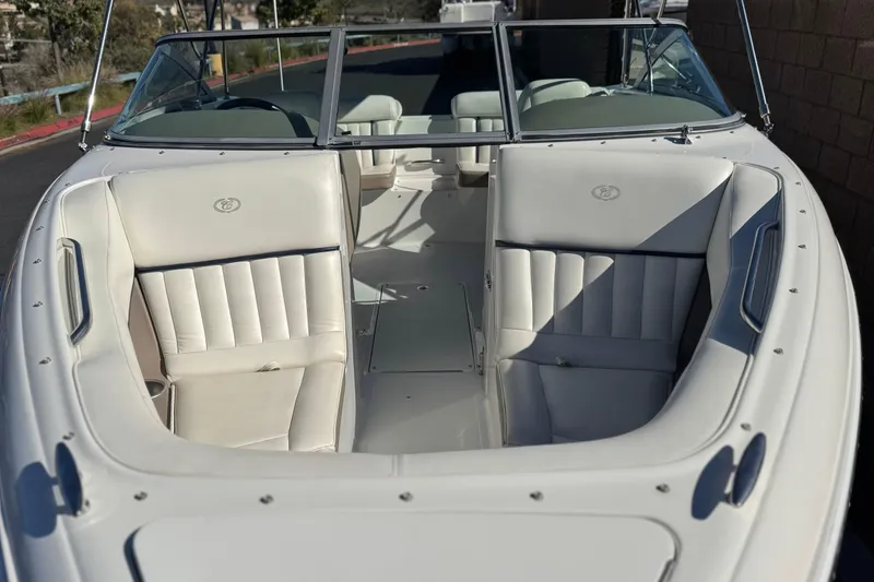 Slide: The Image of 2005 Cobalt 200 boat with white leather seating and open bow design. - 10