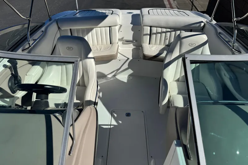 Slide: The Image of 2005 Cobalt 200 boat interior with white leather seats and steering wheel. - 17