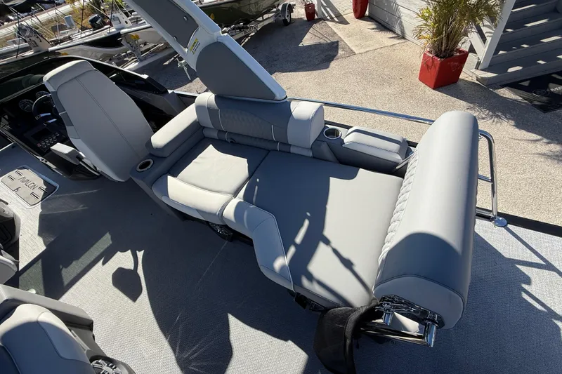 Slide: The Image of 2026 Avalon 2385 Catalina Windshield Quade Lounger with gray seating and cup holders. - 14