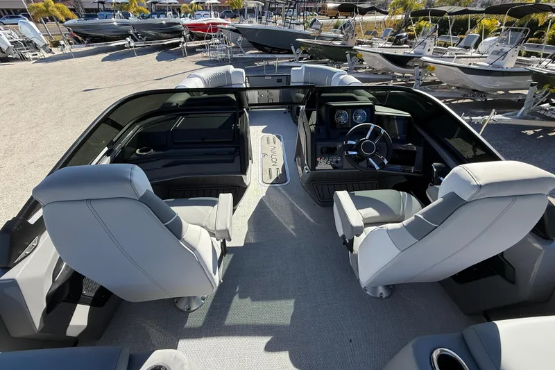 Slide: The Image of Interior of 2026 Avalon 2385 Catalina Windshield Quade Lounger, showcasing helm and seating. - 16